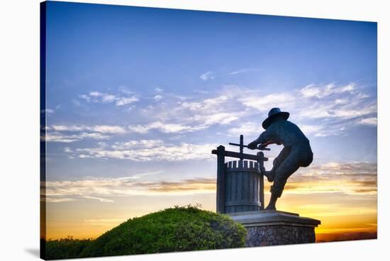 The Grape Crusher Statue agains Dramatic Sky, Napa Valley, California-George Oze-Stretched Canvas