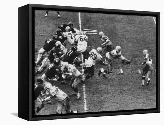 The Green Bay Packers Playing a Game-George Silk-Framed Stretched Canvas