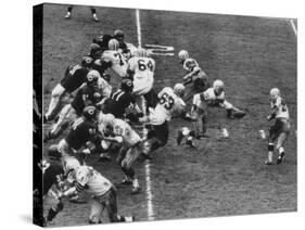 The Green Bay Packers Playing a Game-George Silk-Stretched Canvas