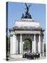 The Grenadier Guards pass through Wellington Arch at Hyde Park Corner-Associated Newspapers-Stretched Canvas