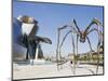 The Guggenheim, Designed by Architect Frank Gehry, and Giant Spider Sculpture by Louise Bourgeois-Christian Kober-Mounted Photographic Print