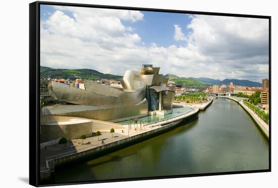 The Guggenheim Museum of Contemporary Art of Bilbao (Bilbo) on the river Ibaizabal, located on t...-null-Framed Stretched Canvas