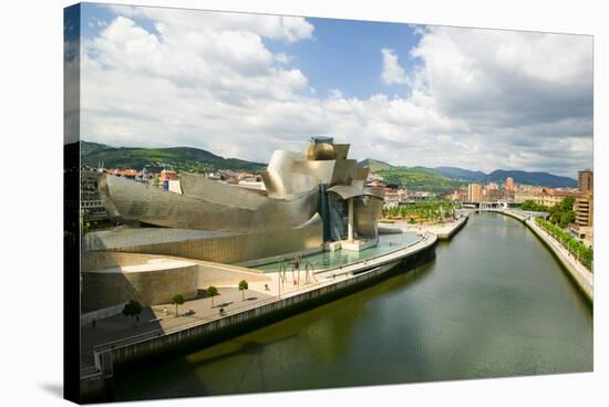 The Guggenheim Museum of Contemporary Art of Bilbao (Bilbo) on the river Ibaizabal, located on t...-null-Stretched Canvas