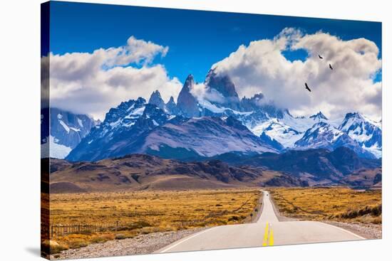The Highway Crosses the Patagonia and Leads to Snow-Capped Peaks of Mount Fitzroy. over the Road Fl-kavram-Stretched Canvas