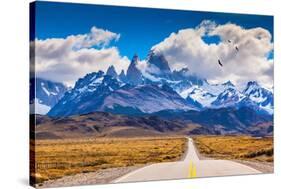 The Highway Crosses the Patagonia and Leads to Snow-Capped Peaks of Mount Fitzroy. over the Road Fl-kavram-Stretched Canvas