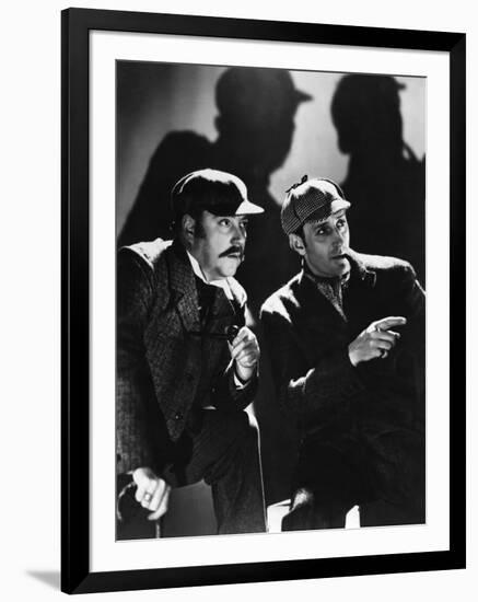 THE HOUND OF THE BASKERVILLES, 1939 directed by SIDNEY LANFIELD. Nigel Bruce and Basil Rathbone (b/-null-Framed Photo