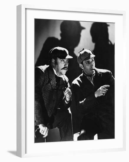 THE HOUND OF THE BASKERVILLES, 1939 directed by SIDNEY LANFIELD. Nigel Bruce and Basil Rathbone (b/-null-Framed Photo