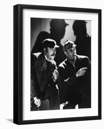 THE HOUND OF THE BASKERVILLES, 1939 directed by SIDNEY LANFIELD. Nigel Bruce and Basil Rathbone (b/-null-Framed Photo