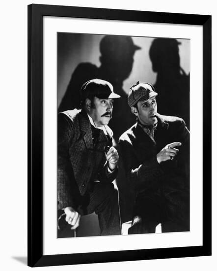 THE HOUND OF THE BASKERVILLES, 1939 directed by SIDNEY LANFIELD. Nigel Bruce and Basil Rathbone (b/-null-Framed Photo