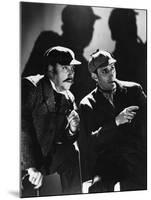 THE HOUND OF THE BASKERVILLES, 1939 directed by SIDNEY LANFIELD. Nigel Bruce and Basil Rathbone (b/-null-Mounted Photo