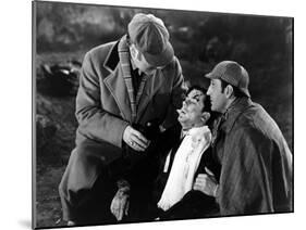 THE HOUND OF THE BASKERVILLES, 1939 directed by SIDNEY LANFIELD. Nigel Bruce, Richard Greene and Ba-null-Mounted Photo