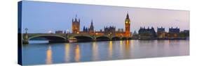 The Houses of Parliament and the River Thames Illuminated at Dusk.-Doug Pearson-Stretched Canvas