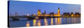The Houses of Parliament and the River Thames Illuminated at Dusk.-Doug Pearson-Stretched Canvas