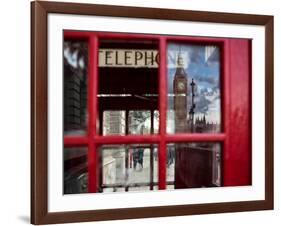 The houses of parliament reflected in an iconic red phone box in Westminster, London.-Alex Saberi-Framed Photographic Print