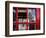 The houses of parliament reflected in an iconic red phone box in Westminster, London.-Alex Saberi-Framed Premium Photographic Print