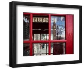 The houses of parliament reflected in an iconic red phone box in Westminster, London.-Alex Saberi-Framed Premium Photographic Print