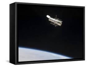 The Hubble Space Telescope in Orbit Above Earth-null-Framed Stretched Canvas