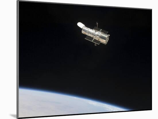 The Hubble Space Telescope in Orbit Above Earth-null-Mounted Photographic Print
