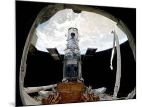 The Hubble Space Telescope, Locked Down in the Cargo Bay of Space Shuttle Atlantis-null-Mounted Photographic Print