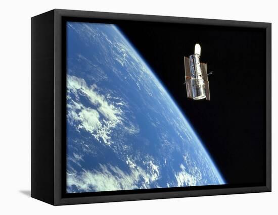 The Hubble Space Telescope with a Blue Earth in the Background-Stocktrek Images-Framed Stretched Canvas