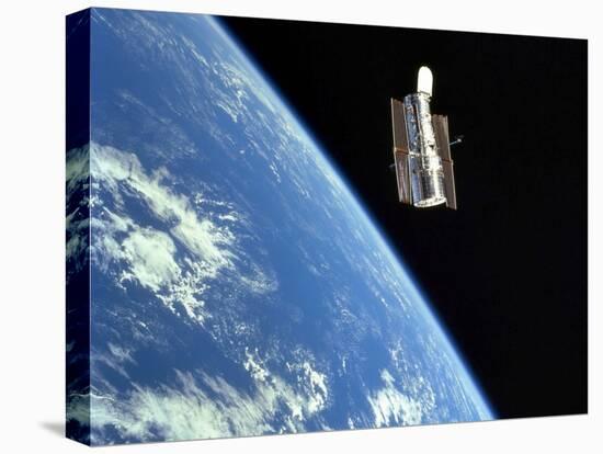 The Hubble Space Telescope with a Blue Earth in the Background-Stocktrek Images-Stretched Canvas