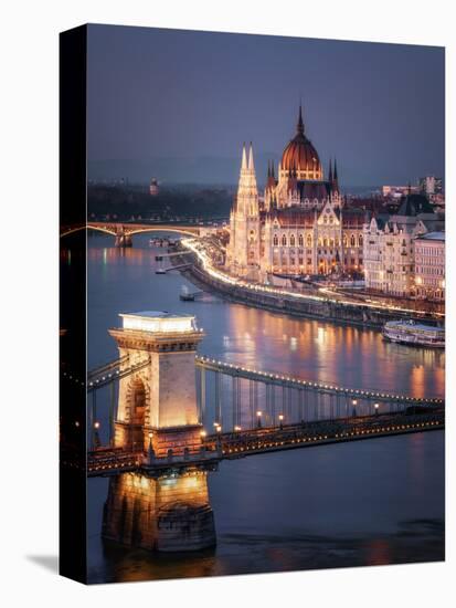 The Hungarian Parliament on the River Danube with the Chain Bridge, Budapest, Hungary-Karen Deakin-Stretched Canvas