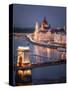 The Hungarian Parliament on the River Danube with the Chain Bridge, Budapest, Hungary-Karen Deakin-Stretched Canvas