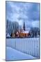 The illuminated church at dusk in the cold snowy landscape at Flakstad Lofoten Norway Europe-ClickAlps-Mounted Photographic Print