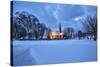 The illuminated church at dusk in the cold snowy landscape at Flakstad Lofoten Norway Europe-ClickAlps-Stretched Canvas