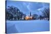 The illuminated church at dusk in the cold snowy landscape at Flakstad Lofoten Norway Europe-ClickAlps-Stretched Canvas