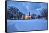 The illuminated church at dusk in the cold snowy landscape at Flakstad Lofoten Norway Europe-ClickAlps-Framed Stretched Canvas