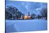 The illuminated church at dusk in the cold snowy landscape at Flakstad Lofoten Norway Europe-ClickAlps-Stretched Canvas