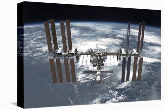 The International Space Station in Orbit Above Earth-null-Stretched Canvas