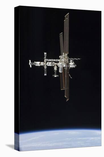 The International Space Station in Orbit Above Earth-null-Stretched Canvas