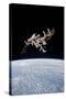 The International Space Station in Orbit Above Earth-null-Stretched Canvas