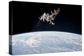 The International Space Station in Orbit Above Earth-null-Stretched Canvas