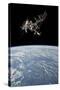 The International Space Station in Orbit Above Earth-null-Stretched Canvas