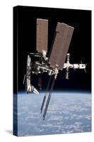 The International Space Station in Orbit Above Earth-null-Stretched Canvas