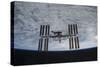 The International Space Station in Orbit Above Earth-null-Stretched Canvas