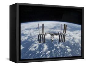 The International Space Station in Orbit Above the Earth-null-Framed Stretched Canvas
