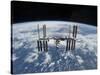 The International Space Station in Orbit Above the Earth-null-Stretched Canvas