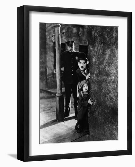 The Kid, Tom Wilson, Charles Chaplin, Jackie Coogan, 1921-null-Framed Photo