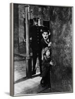 The Kid, Tom Wilson, Charles Chaplin, Jackie Coogan, 1921-null-Framed Photo