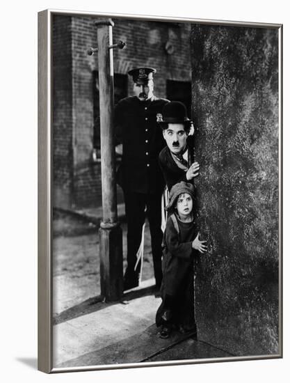 The Kid, Tom Wilson, Charles Chaplin, Jackie Coogan, 1921-null-Framed Photo