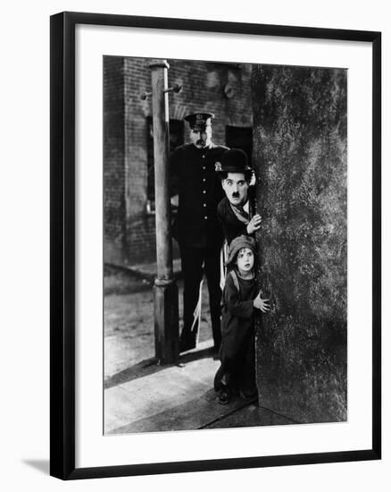 The Kid, Tom Wilson, Charles Chaplin, Jackie Coogan, 1921-null-Framed Photo