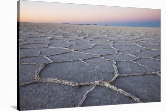 The largest salt flats in the world located in Uyuni, bolivia as the sun is rising in winter.-Mallorie Ostrowitz-Stretched Canvas