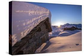 The Last Rays of Sun Light Up the Prabello Alp Chalets Covered with Snow-ClickAlps-Stretched Canvas
