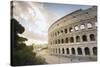 The lights of sunrise frame the ancient Colosseum (Flavian Amphitheatre), UNESCO World Heritage Sit-Roberto Moiola-Stretched Canvas