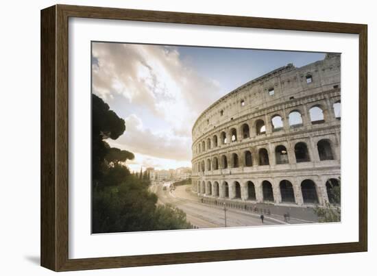 The lights of sunrise frame the ancient Colosseum (Flavian Amphitheatre), UNESCO World Heritage Sit-Roberto Moiola-Framed Photographic Print