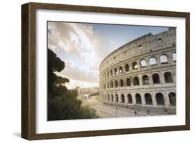 The lights of sunrise frame the ancient Colosseum (Flavian Amphitheatre), UNESCO World Heritage Sit-Roberto Moiola-Framed Photographic Print